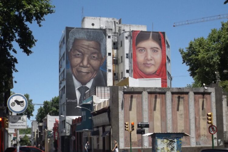 A picture of Malala Yousafzai next to one of Nelson Mandela on a street in Montevideo. / Photo: Jecarvallido / iStock