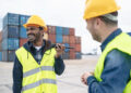 A Pakistani worker with a Spanish worker at the port of Valencia. / Photo: Alessandro Biascioli / iStock